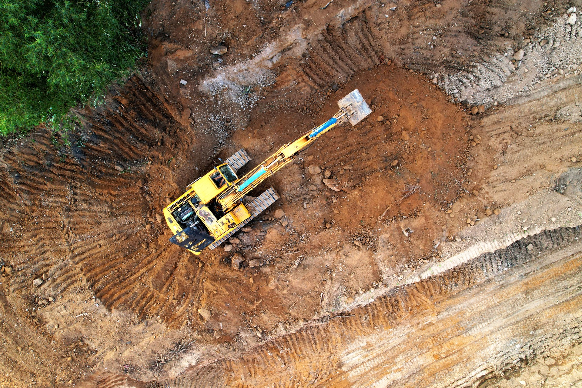 Excavator on earthmoving at construction site.